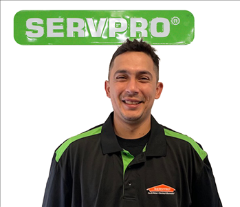 Victor Bravo, male, SERVPRO employee against a white background and green SERVPRO logo